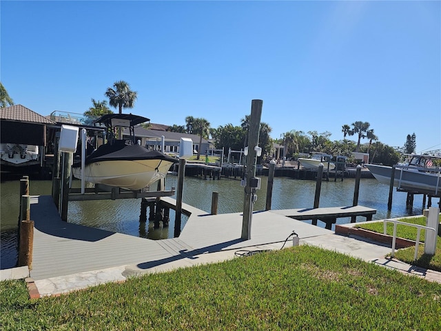 dock area featuring a water view and boat lift