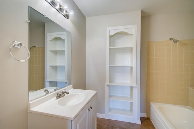 bathroom featuring shower / bath combination, tile patterned flooring, built in shelves, and vanity