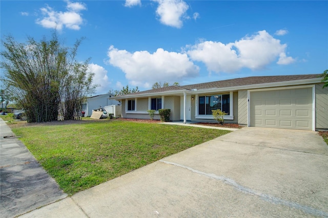 ranch-style house featuring a garage, driveway, and a front yard