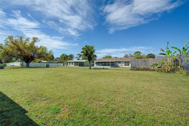 view of yard with a fenced backyard