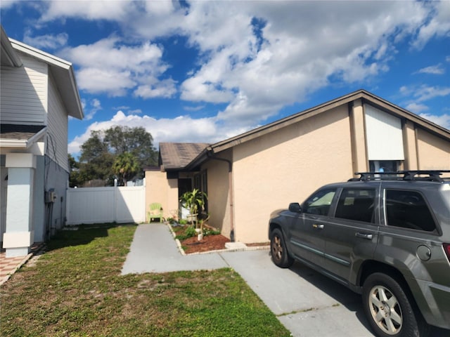 view of property exterior featuring a yard