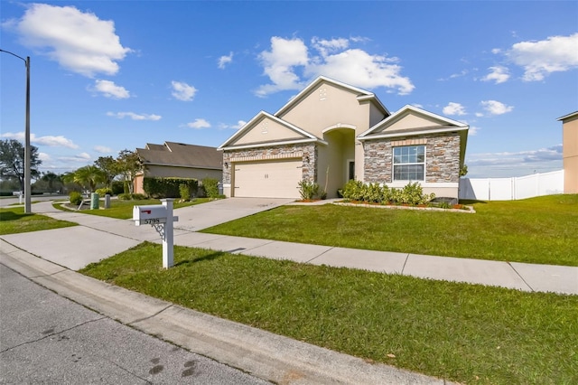 view of front of property featuring a garage and a front yard