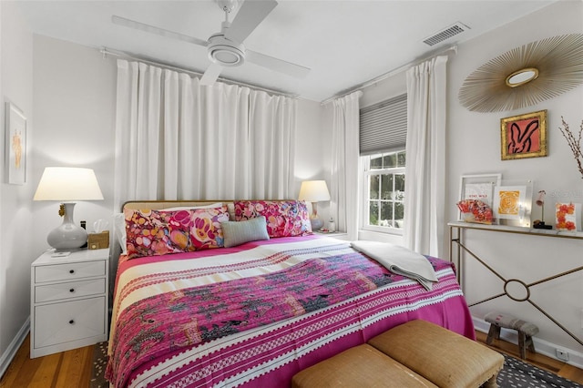 bedroom featuring hardwood / wood-style floors and ceiling fan