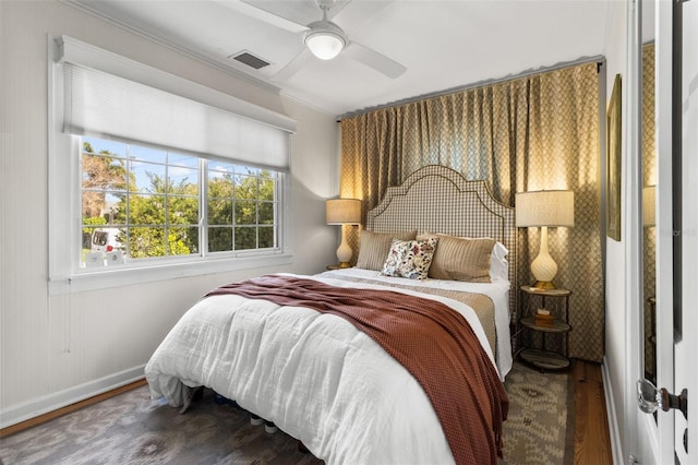 bedroom with hardwood / wood-style flooring and ceiling fan