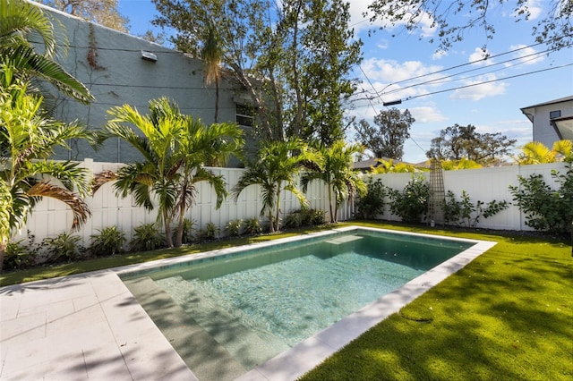 view of pool featuring a yard