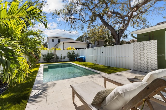 view of swimming pool with a patio