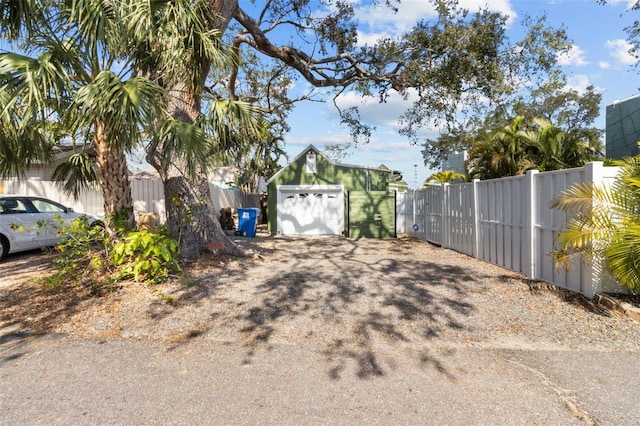 view of yard with an outbuilding and a garage