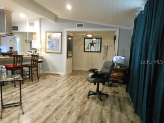 interior space with wood-type flooring, vaulted ceiling with beams, and wood ceiling