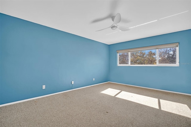 unfurnished room featuring carpet and ceiling fan