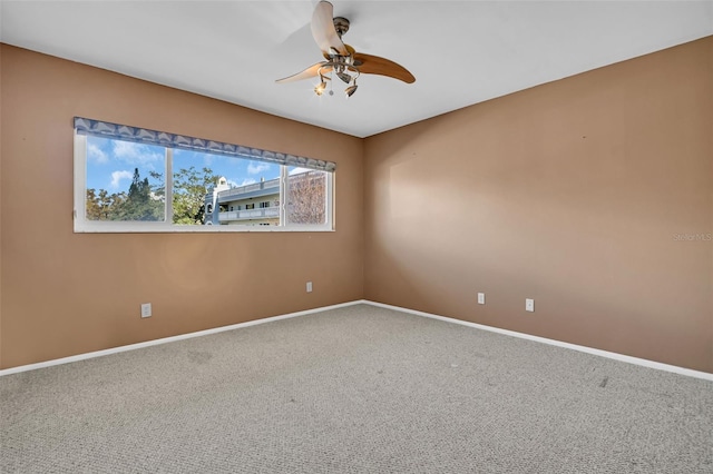 carpeted empty room with ceiling fan