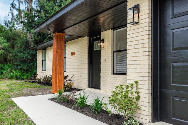 doorway to property featuring covered porch