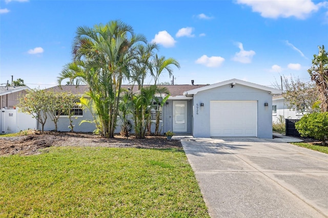 single story home with a garage and a front lawn