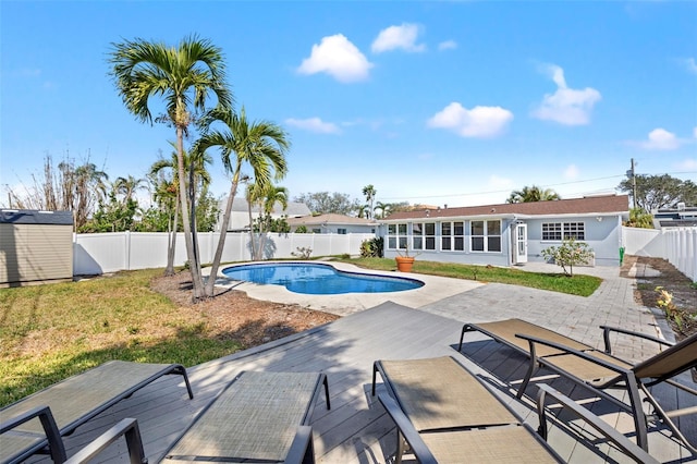 view of pool with a patio and a sunroom