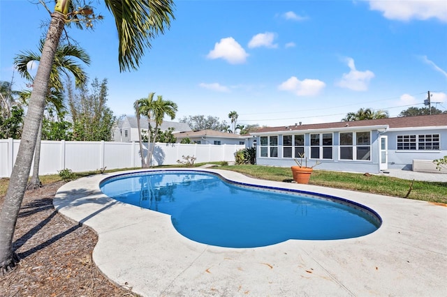 view of pool featuring a sunroom