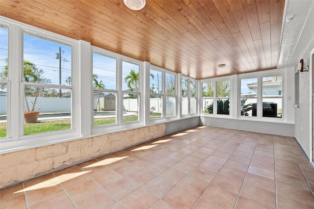 unfurnished sunroom featuring wood ceiling