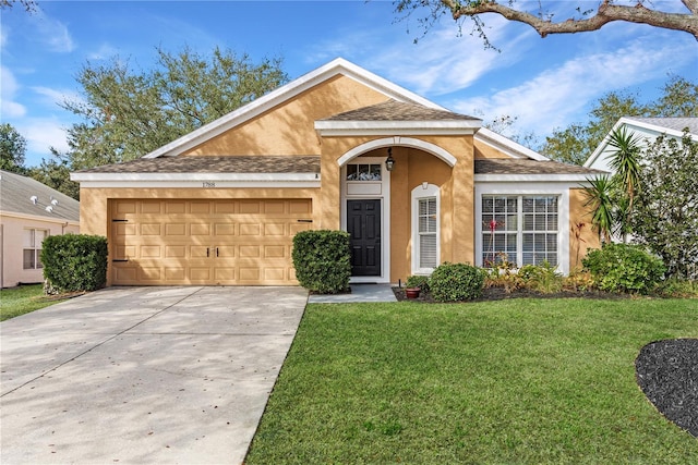 single story home with a garage and a front yard