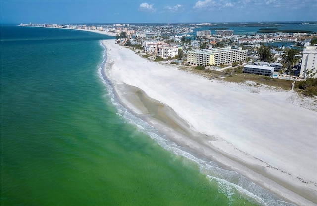 bird's eye view featuring a view of the beach and a water view