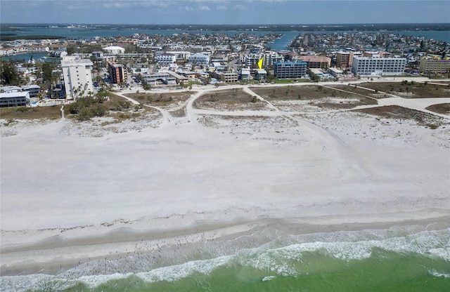 bird's eye view featuring a water view and a view of the beach