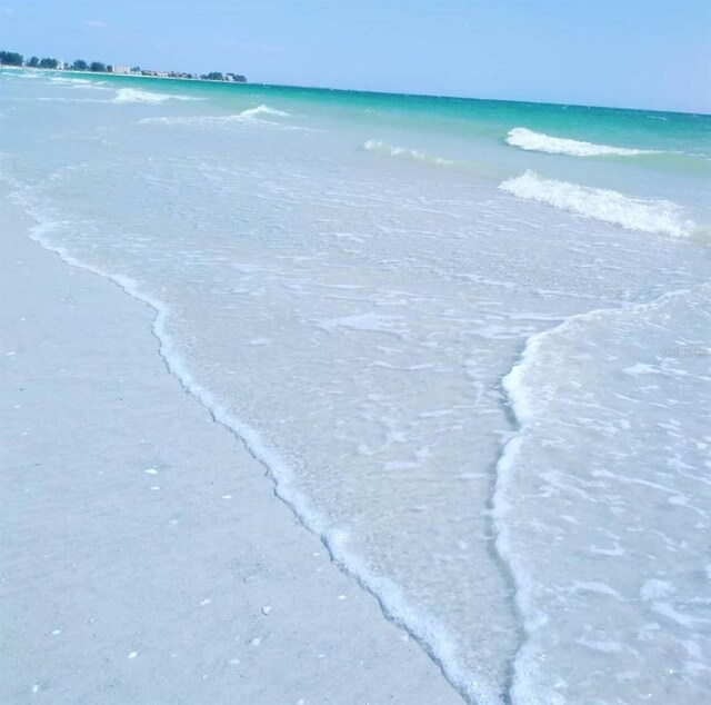 view of water feature with a beach view