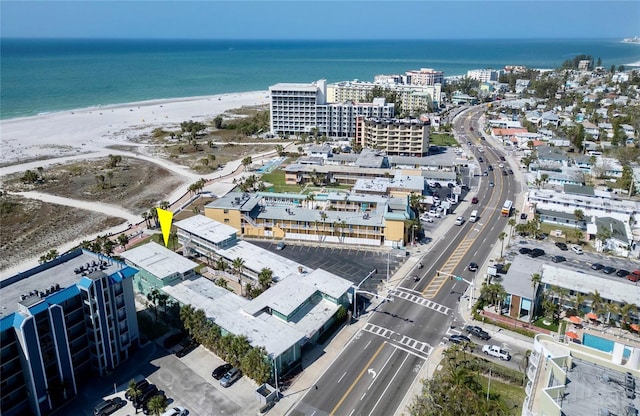 birds eye view of property featuring a water view and a view of the beach