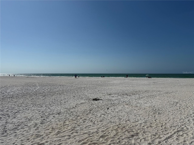 property view of water featuring a beach view