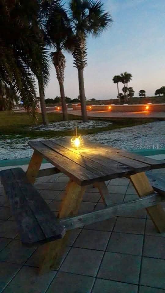 view of pool at dusk