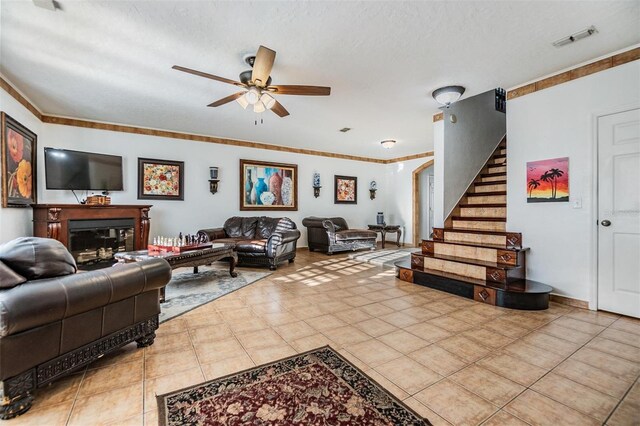 2786 Countryside Blvd Unit 2, Clearwater, FL 33761 - living room with crown molding, ceiling fan, and light tile patterned flooring