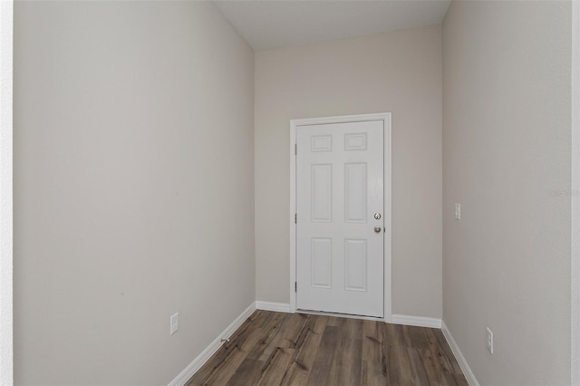 empty room with dark hardwood / wood-style floors