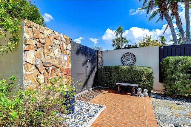 view of patio featuring fence