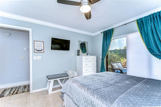 bedroom featuring crown molding, light tile patterned floors, a ceiling fan, a textured ceiling, and baseboards