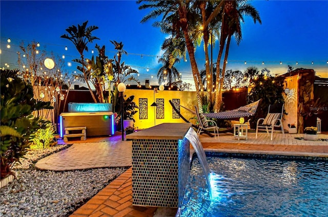 view of swimming pool featuring a patio area and fence