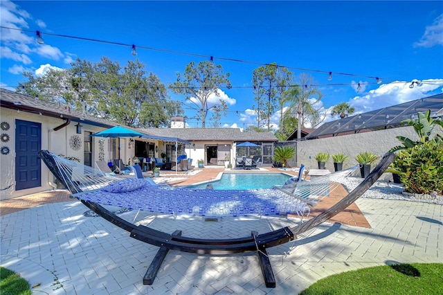 view of swimming pool with fence, a fenced in pool, and a patio