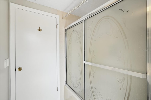 bathroom featuring an enclosed shower