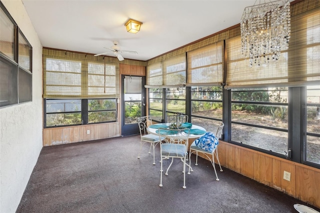 sunroom / solarium featuring a wealth of natural light and ceiling fan