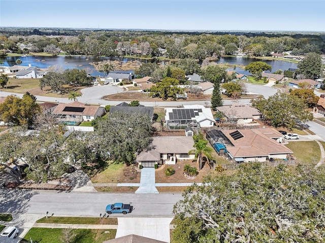 bird's eye view featuring a water view and a residential view