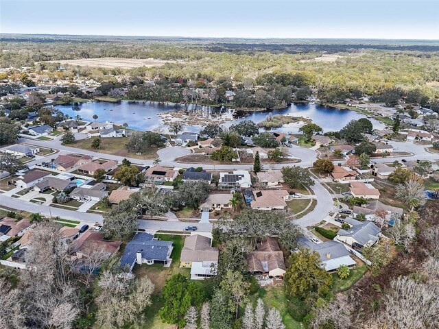 drone / aerial view with a residential view and a water view