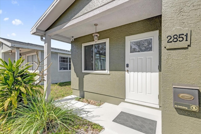 doorway to property featuring a patio area