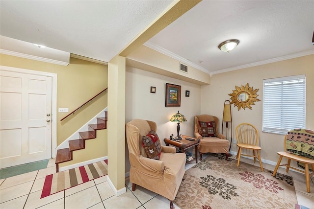 living area featuring light tile patterned floors, ornamental molding, and a textured ceiling