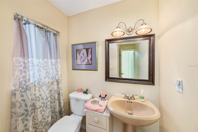 bathroom featuring sink and toilet