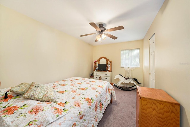 bedroom featuring ceiling fan and carpet