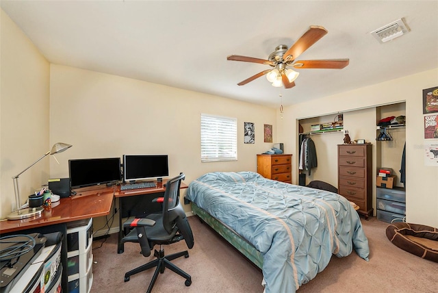 bedroom with ceiling fan, a closet, and light carpet