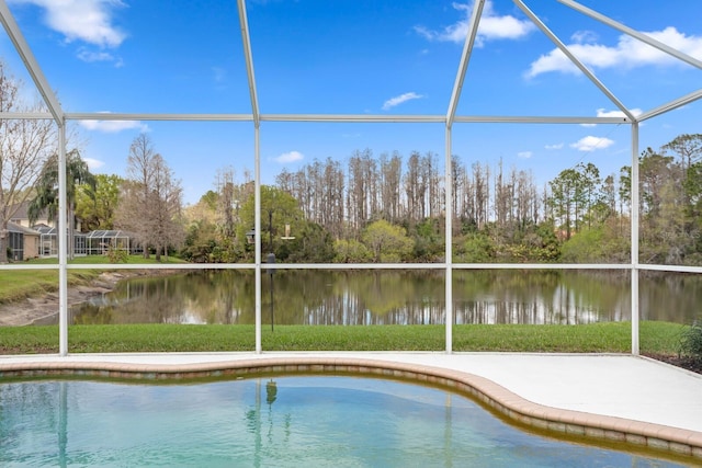 view of swimming pool with glass enclosure and a water view