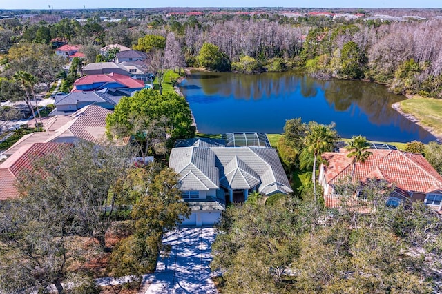 bird's eye view featuring a water view and a view of trees