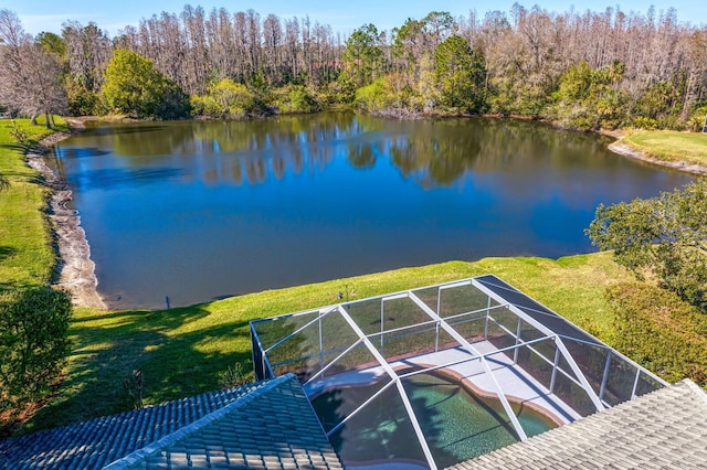 bird's eye view with a water view and a view of trees