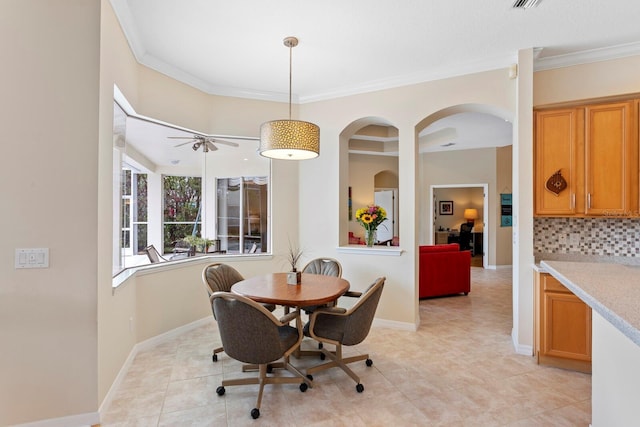 dining space featuring ornamental molding, visible vents, baseboards, and light tile patterned flooring