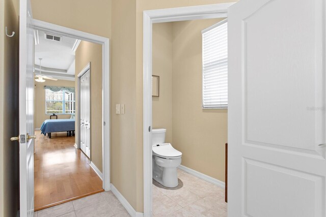 bathroom with toilet, baseboards, visible vents, and tile patterned floors