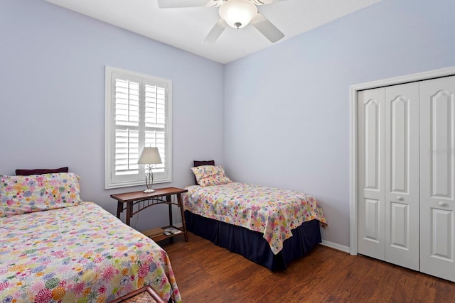 bedroom featuring baseboards, a closet, a ceiling fan, and wood finished floors