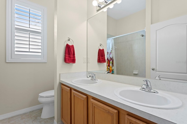 bathroom featuring toilet, tile patterned flooring, a sink, and a shower with shower curtain