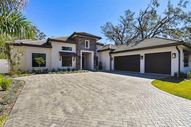 prairie-style house featuring a garage