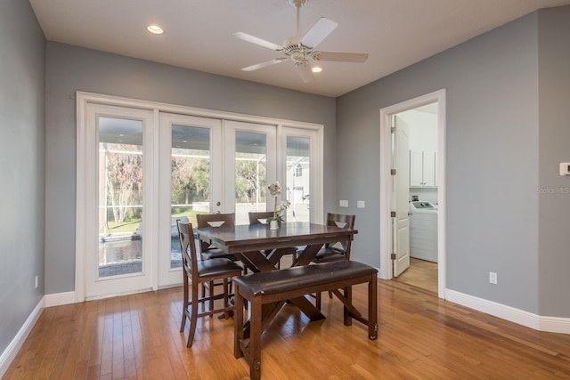 dining area featuring light wood-style floors, recessed lighting, washer / dryer, and baseboards